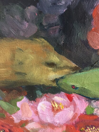 A mongoose biting the head of a cobra. Tight crop on only the heads.