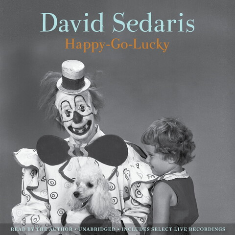 Cover art for audiobook Happy-Go-Lucky. It shows a black and white photo of a seated, smiling clown holding what looks like a poodle, with a young child standing next to them. The clown seems to have white face paint, a fascinator top hat over unkempt medium-length hair, an oversized propeller-shaped bow tie, and a light-colored clown outfit with dark piping and a pattern of silver dollar-sized circles, each with a smaller circle inside. The child has short curly light-colored hair, a sleeveless outfit, and seems smiling. The dog has its tongue out and seems relaxed. 