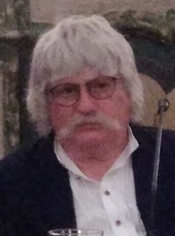 Sir Karl Jenkins, 79, with white hair and long white mustache