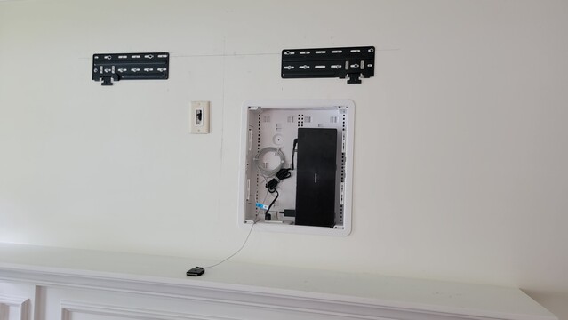Custom enclosure behind the TV to hold the Samsung Connect receiver and power.