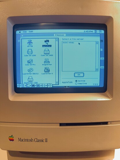 A picture of Mac Classic II showing the Chooser from System 7.5.3. AppleShare is selected in the left pane. In the right hand side, a file server named "mini vmac" is visible.