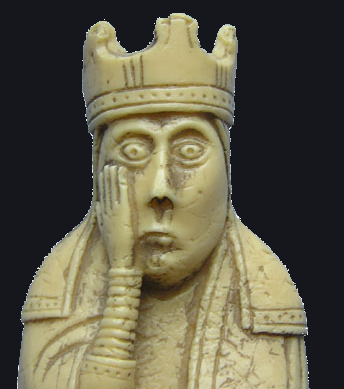 A close up of an old chess figure from the Lewis-chessmen set, looking a bit dazzled.