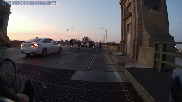 Cyclists riding over the Hanover Street Bridge in downtown Baltimore.