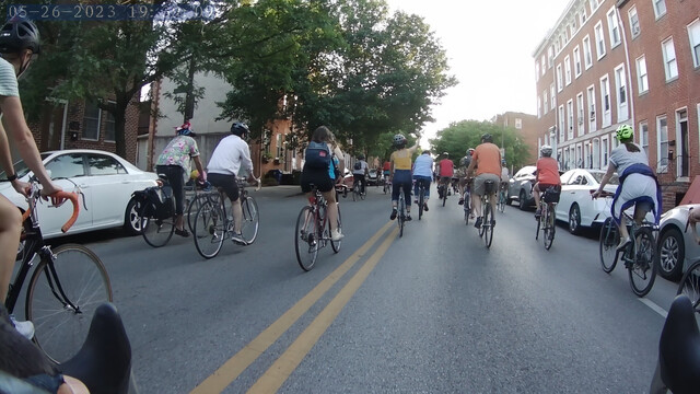 Cyclists stream through downtown Baltimore.
