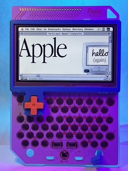 A PocketCHIP handheld computer showing a emulated Mac running System 7.5.5. Netscape 2.0 is running on the Mac and showing the Apple homepage from 1998 when the iMac was introduced. It says hello in a script font and below in a serif font it says (again).