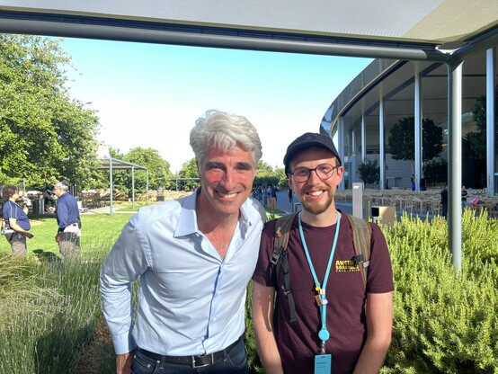Craig Federighi (left) standing next to me (right) in front of Apple Park’s cafe Mac. I wear my red Ancient Board Game Collection Shirt
