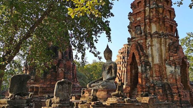 Ancient Buddhist ruins with Buddha statues.