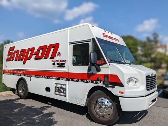 A Snap-On tools truck displays the driver name Hugh McQueeney