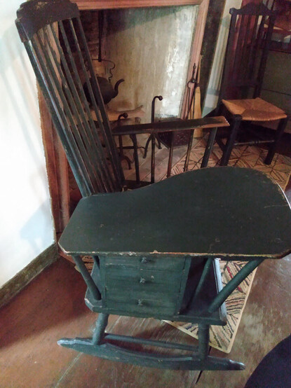This astoundingly cool rocking chair with a huge right arm like a school desk kind, but also has a set of 3 small drawers under the oversized work area arm. It looks so great for a work chair for needlework or mending. 

Chair's backstory can be found in Historic New England archives here: https://www.historicnewengland.org/explore/collections-access/gusn/3147