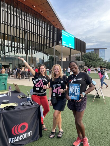 Three voter registration volunteers at the Janet Jackson show outside Moody Center in Austin