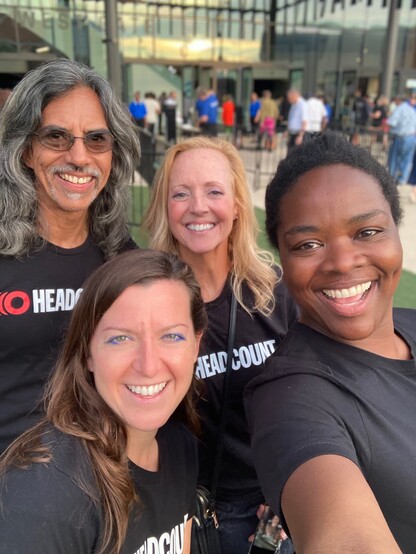 Selfie of 4 Headcount team members outside Moody Center