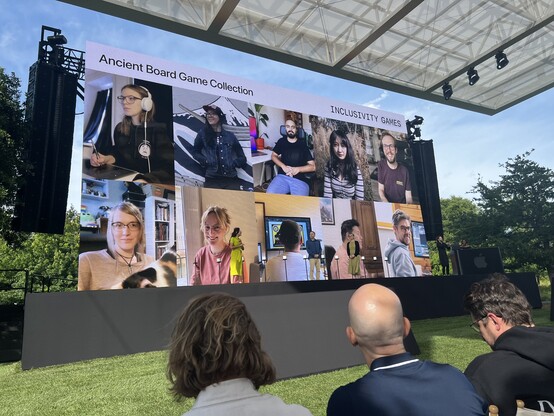 Stage at Apple Park, showing Pictures of the 10 people who’ve worked on the Ancient Board Game Collection