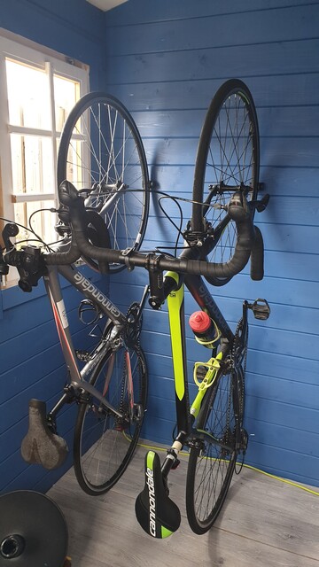 Hornit Clug Pro in position - nailed to a wall and holding two bikes firmly in place