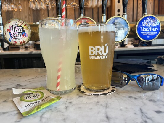 A pint of water and a pint of beer together on the bar at The Beer Temple
