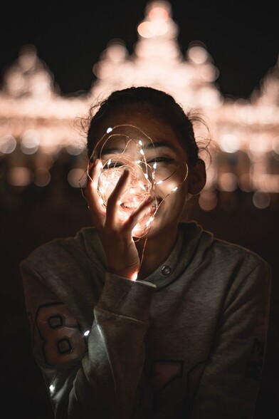 This compelling image showcases the power of AI in identifying emotions, even in low-light conditions. The girl's smile, illuminated solely by a faint light, symbolizes the insights AI can glean from seemingly obscure emotional cues. This ability to understand and interpret human emotions is central to our Empathy Learning Tool.