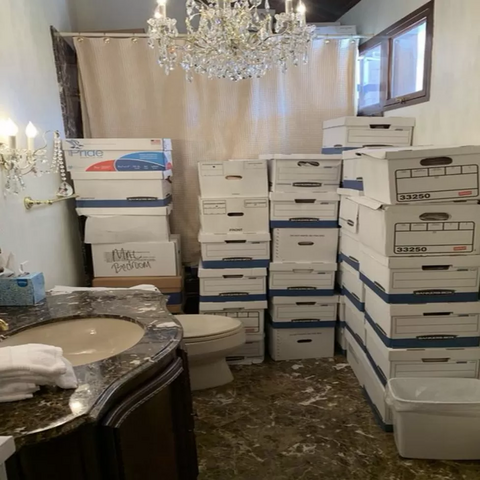 Picture of file boxes stacked in a bathroom at Mar-a-Lago, as printed in the Trump indictment.