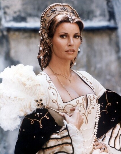 Two pictures of the late actress Raquel Welch in the 1973 swashbuckling adventure film “The Three Musketeers”. In one she is wearing an elaborate gown and in another she’s wearing a simple, white sleeping dress.