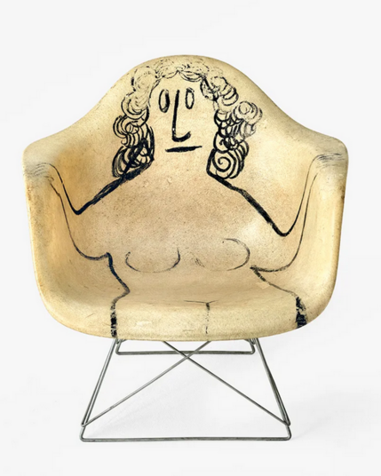 Saul Steinberg. 1950. Manufacturer: Office of Charles and Ray Eames. Medium: Fiberglass, steel, paint. Dimensions: 23 1/16 x 24 15/16 x 24 5/8 in. © Vitra, photo: Tom Ziora.
Featuring a plastic chair with metal legs. On the white plastic chair, a woman is drawn, with black lines. She is nude. Her head rest behind and the hands rest on the chair arms. 