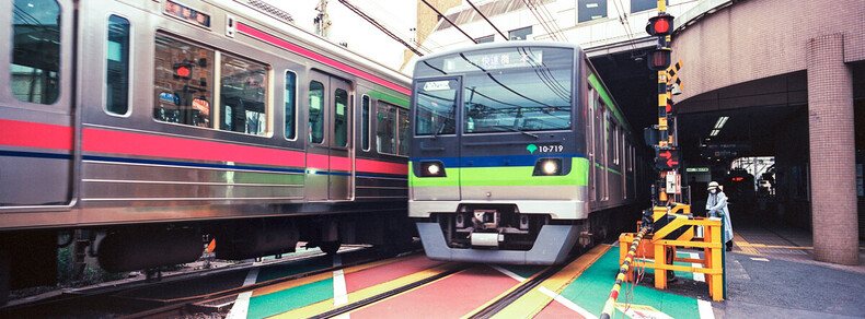 Two trains at a rail crossing in Tokyo, with Fujifilm TX-1 and Kodak Ektar 100