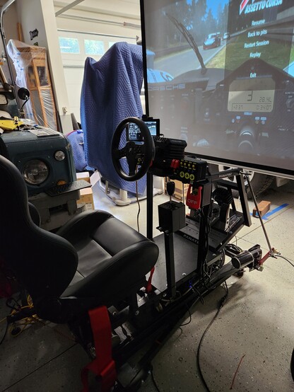 Simulator with chair in front of screen