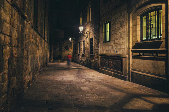 Medieval street in the Gothic Quarter (Barri Gotic) of Barcelona city at night in Catalonia, Spain.