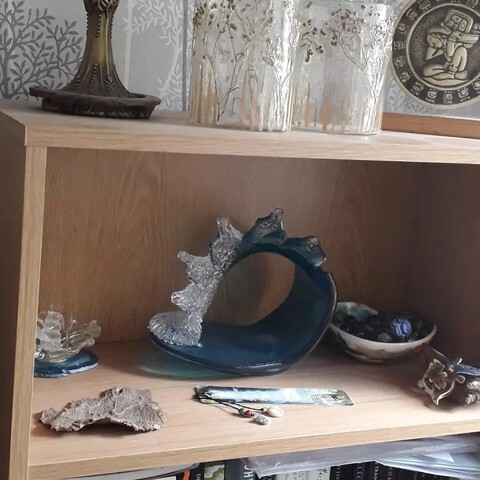 Seawitchery altar containing mainly glass, shell, and ceramic items.