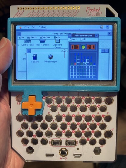 A PocketCHIP running MiniVMac emulating. PC with SoftPC. Minesweeper is on the screen. 
