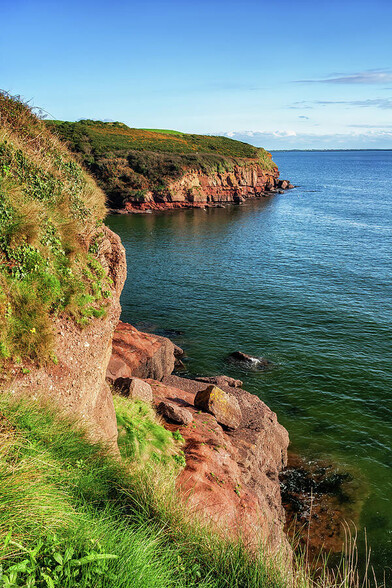 Southern Ireland scenic coastline of the Celtic Sea in County Waterford on tranquil, sunny day.