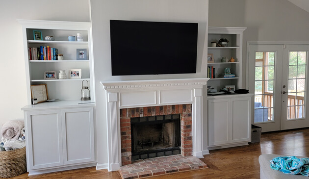 Good looking TV install over a brick fireplace we completed.