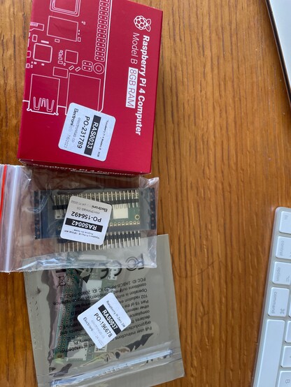 A picture containing three dev boards: Raspberry Pi 4b 8 Gb, a Raspberry pi pico W and a Raspberry Pi zero 2 W. A small portion of a keyboard is visible.