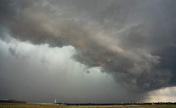 A thick rain cloud rolling in over Tempelhof airfield.