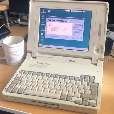 Vintage Compaq PC laptop computer running Windows 95.