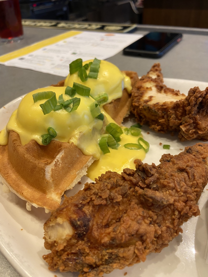 Eggs Benedict on Belgian waffle with chicken