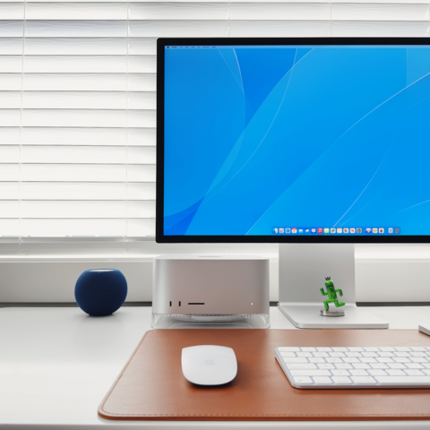 Mac Studio on clear stand.