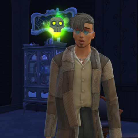 Gunther, a male Young Adult Spellcaster visiting Magic HQ with his floating skull familiar. Grey-haired in spite of his youth, he wears spectacles with blue heart-shaped lenses, a long coat of patchwork brocade, a button-up shirt half untucked, and dark grey courduroy pants. A lunar themed necklace shows under his partly open shirt, and his facial hair is styled as a dubious chin-strap.