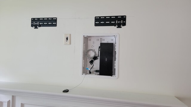 Panel box we wired with electrical and installed behind the TV to hold the Samsung Connect box.