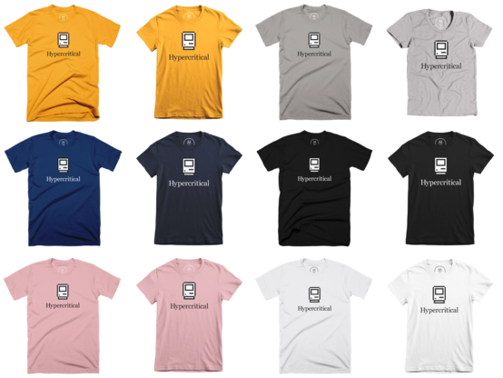 Twelve t-shirts in gold, gray, navy, black, pink, and white, featuring the Hypercritical logo: pixel art of a front-view of a classic Macintosh above the word “Hypercritical” set in a serif font.