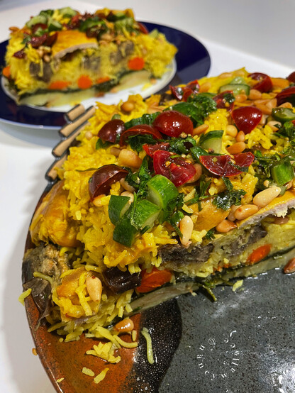 You can see all the layers of this dish here: the potatoes are on the bottom, then the greens, the carrots, roasted eggplant, and of course the Basmati rice, and then the chicken. On the top is the gremolata as previously described. 
