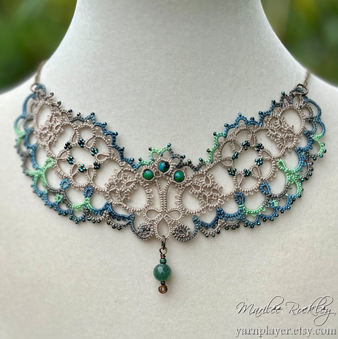 Handmade lace necklace resembling outstretched wings.