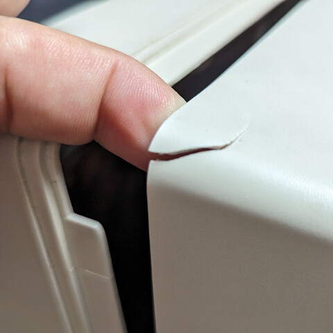 Broken piece of plastic in the corner of the monitor.