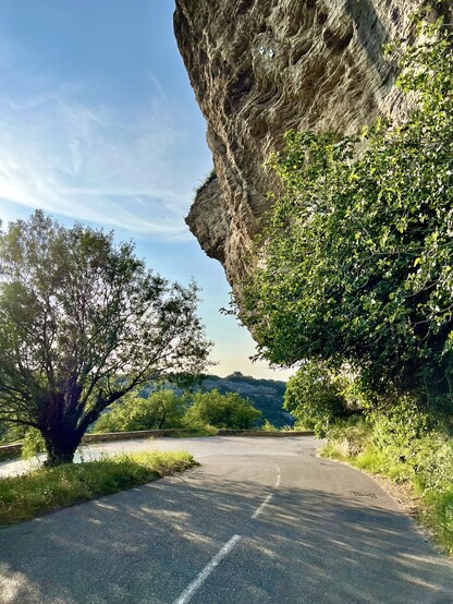 Road to access of the village from south go below a large cliff formation 