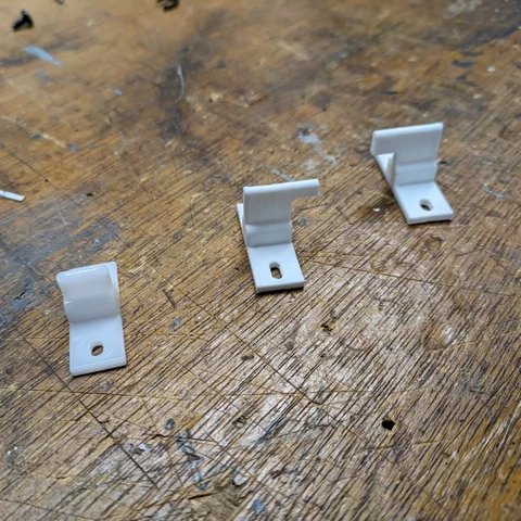 Original part and two versions of the new part