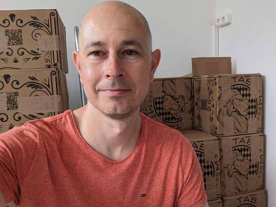 Boxes of metabrew beer and the author in foreground 