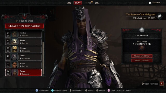 A Necromancer in purple robes glowers at the camera from under his heavy brow. His full lips are visible through a great bushy brown beard. 