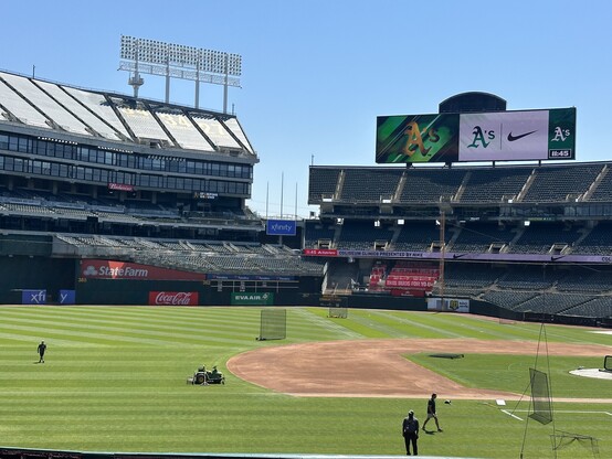 View out over the Oakland A’s field from the stands (section 123). Field is being prepped for tonight, and also for the kids clinic they’re about to start. 