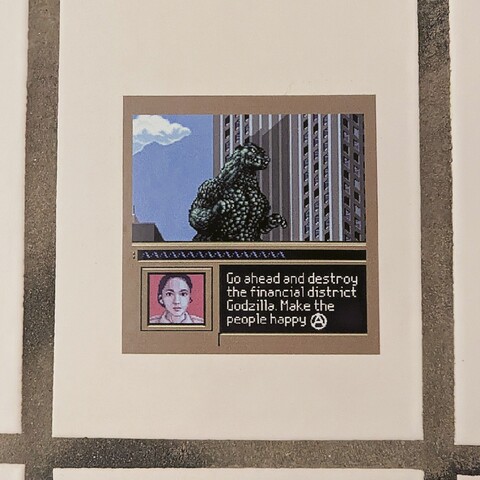 A Sticker on a tile on a toilett wall with Godzilla in it and the Picture of Al Lady in the left edge saying "Go ahead and destroy the financial district Godzilla. Make the people Happy" 