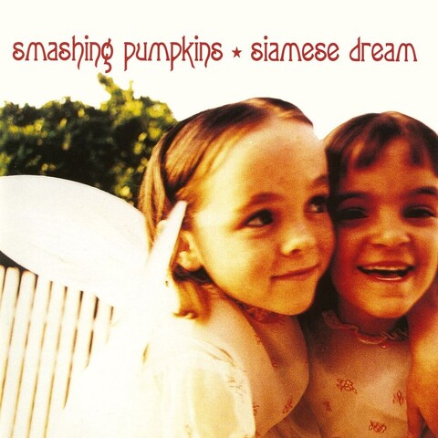 Album cover for Siamese Dream by The Smashing Pumpkins, featuring two young girls playing dress-up, one with fairy wings on her back.