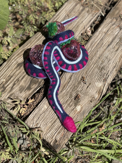 Felted snake with blown glass raspberries