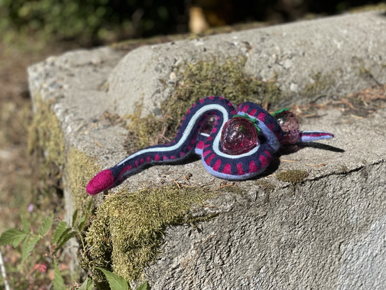 Felted snake with blown glass raspberries