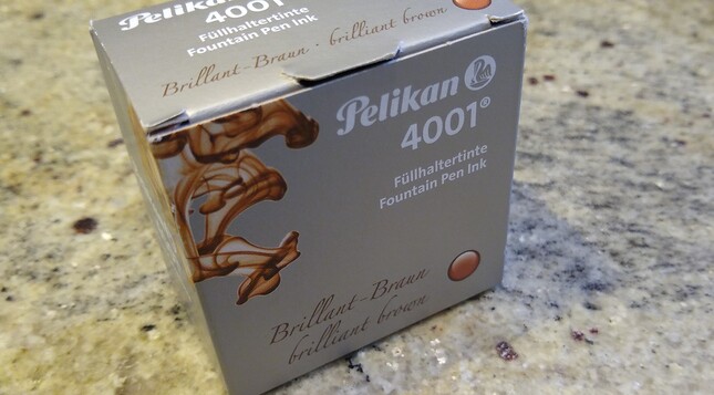 A box from German corp Pelikan, contains a small bottle of brown ink suitable for filling fountain pens.